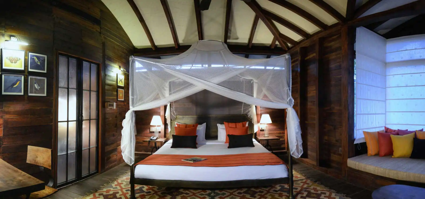 Four poster bed in a tree house at Pench Tree Lodge
