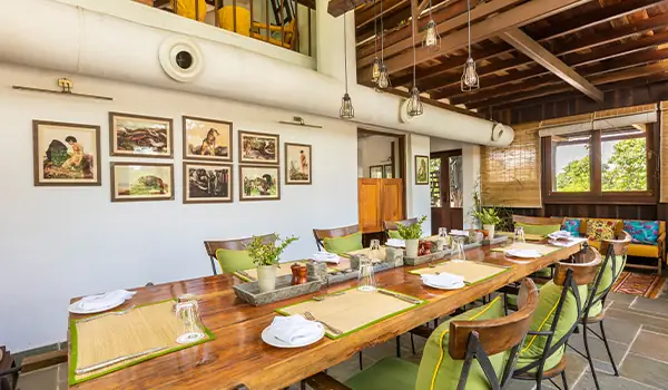 Indoor dining area at Pench Tree Lodge